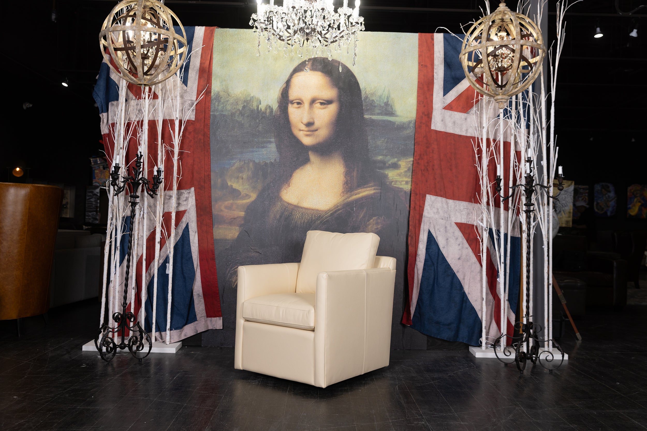 LIONEL LEATHER SWIVEL CHAIR FLOOR MODEL