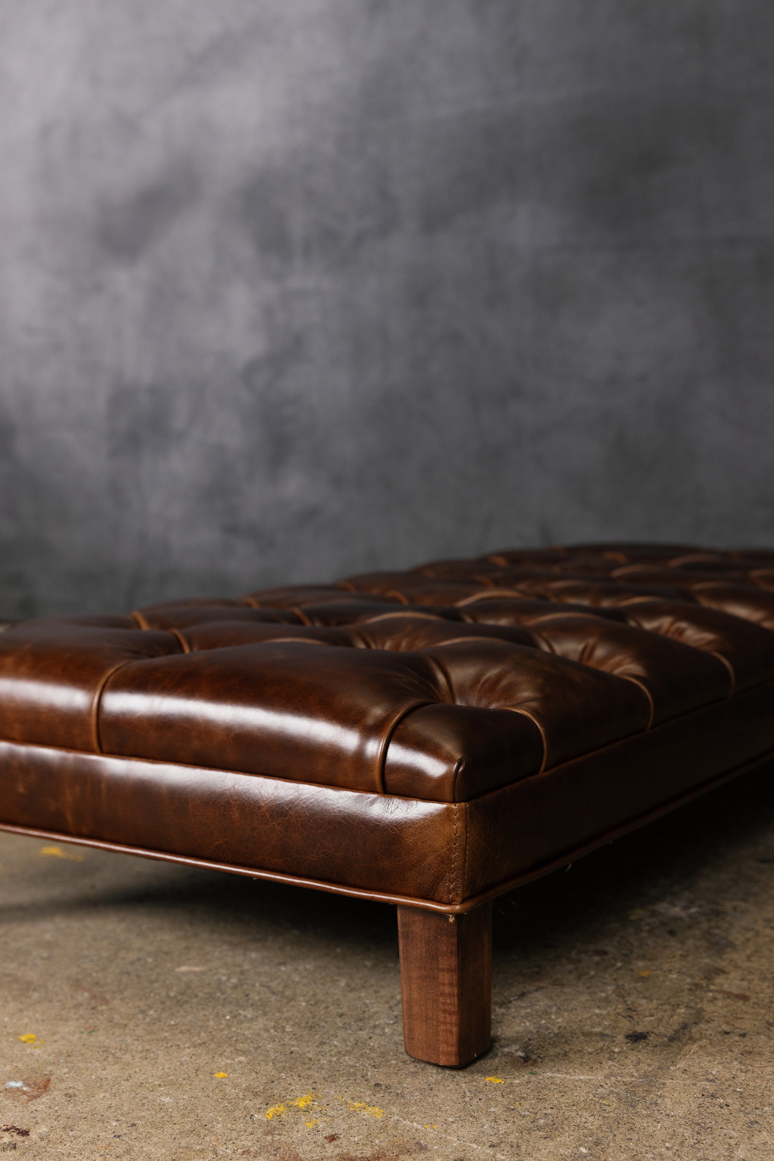 CHATEAU LEATHER TUFTED OTTOMAN