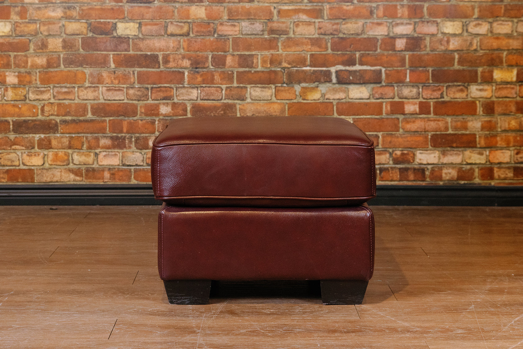 BROWN CUSHION OTTOMAN FLOOR MODEL