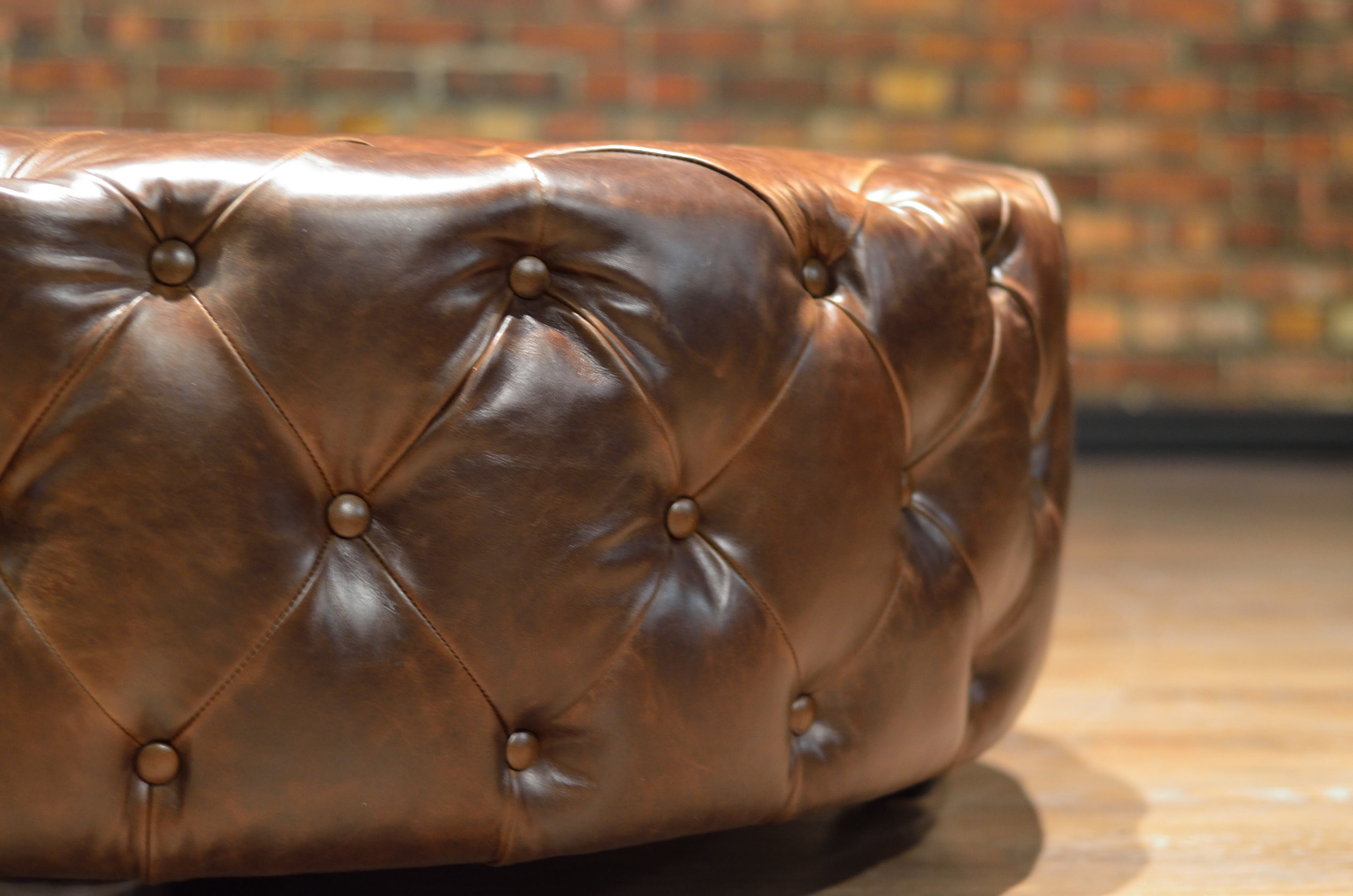 ROYAL DECADENCE ROUND TUFTED LEATHER OTTOMAN