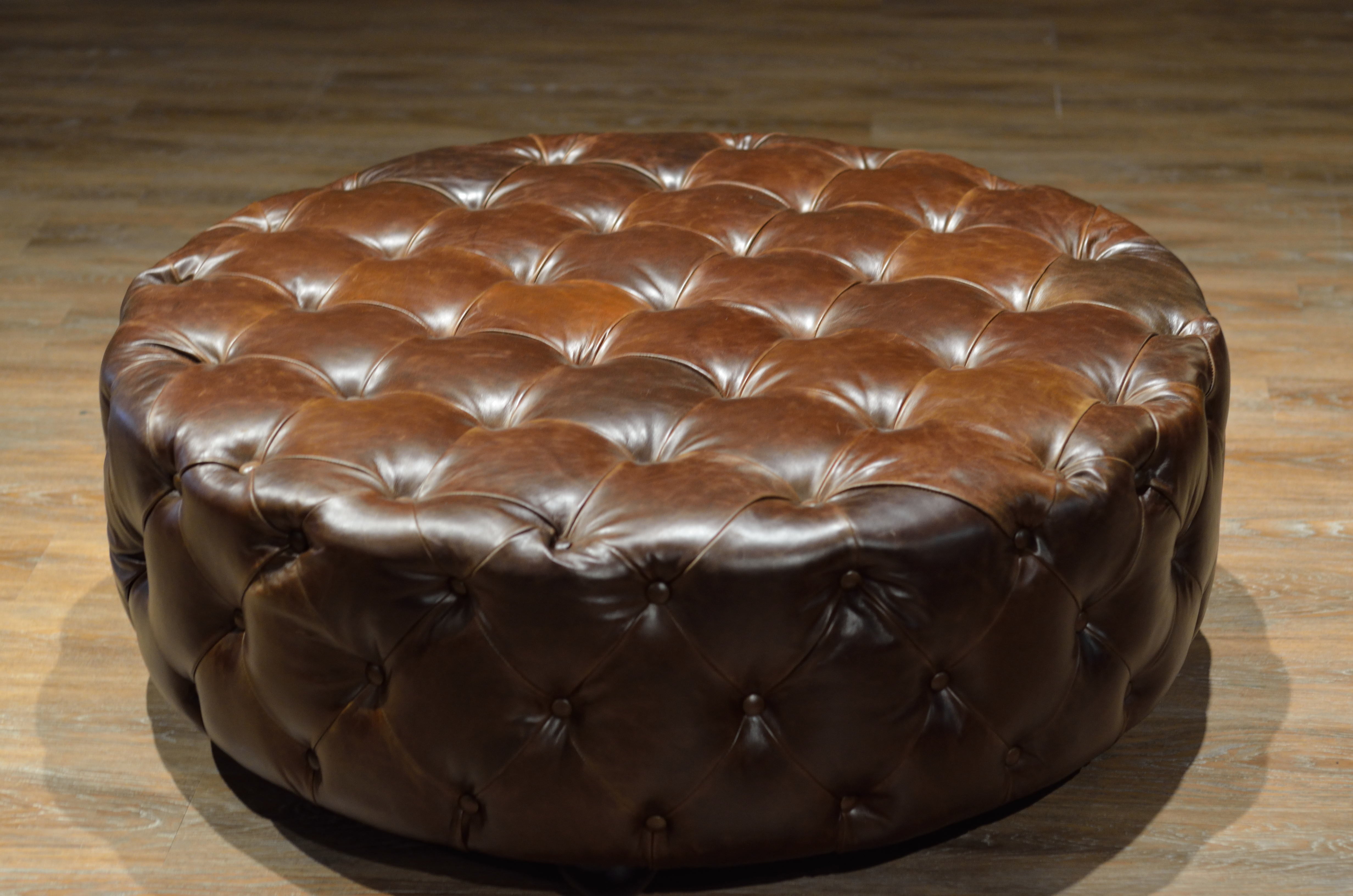 ROYAL DECADENCE ROUND TUFTED LEATHER OTTOMAN